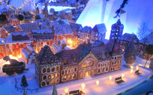 Exhibición del pueblo de pan de jengibre más grande del mundo en Nueva York durante la temporada navideña, con casas y calles comestibles.